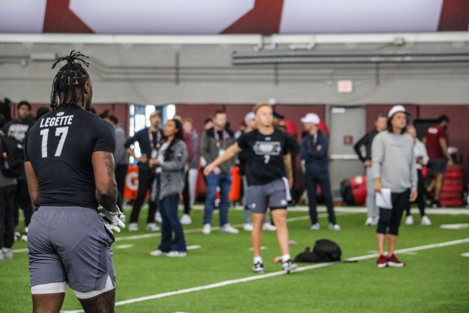 Xavier Legette looks toward Rattler to see what he wants for the next rep